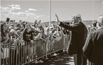  ?? Doug Mills / New York Times ?? President Donald Trump greets supporters Thursday at the Wilkes-Barre Scranton Internatio­nal Airport in Avoca, Pa., before Joe Biden’s nomination acceptance speech.