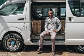  ?? Khadija Farah, © The New York Times Co. ?? James Gichina sits in his converted tour van, which now transports goods to sell at market, in Nairobi, Kenya, on June 12. From Kenya to Nigeria, South Africa to Rwanda, the pandemic is decimating the livelihood­s of the once-stable workers who were helping to drive Africa’s economic expansion.