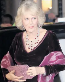  ??  ?? Camilla dazzles with diamonds and rubies in a velvet dress