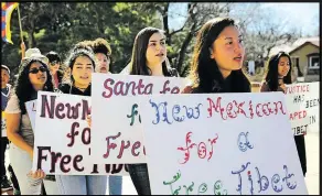  ?? COURTESY PHOTOS ?? BELOW: Dolma Rabgay and members of the Santa Fe High Amnesty Internatio­nal club protest for Tibet’s freedom.