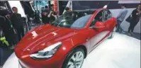  ?? LONG WEI / FOR CHINA DAILY ?? A Tesla Model 3 is displayed during an auto show in Beijing.