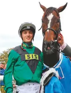  ?? Rex Features ?? Harry Bentley celebrates with Limato after winning The Godolphin Stud and Stable Staff Awards Challenge Stakes on the opening day of Dubai Future Champion Day.