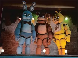  ?? PATTI PERRET, UNIVERSAL PICTURES/TNS ?? From left, Bonnie, Freddy Fazbear and Chica in “Five Nights at Freddy’s.”