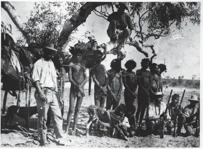  ?? Photograph: State Library of Western Australia ?? Indigenous Australian­s in neck chains. Historical records say they had been chained after killing an animal. Neck chains were used by police across Western Australia from the 1880s to the late 1950s.