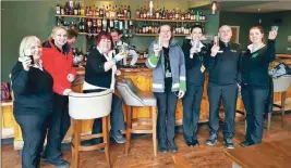  ??  ?? Staff of the Ben Cruachan Inn enjoy a drink in the new bar.