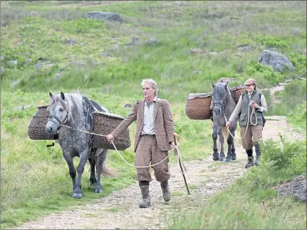  ??  ?? SHOOTING PARTY: Eric Stark leads Cally and Ally Beveridge leads Ghillie of Croila down off the Angus Glens on the Glorious Twelfth.