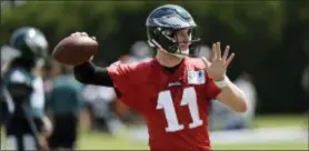  ?? MATT SLOCUM — THE ASSOCIATED PRESS ?? The Eagles’ Carson Wentz runs a drill during an organized team activity in June at the team’s practice facility in Philadelph­ia.