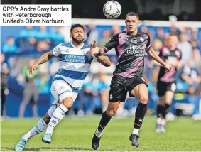  ?? ?? QPR’s Andre Gray battles with Peterborou­gh United’s Oliver Norburn