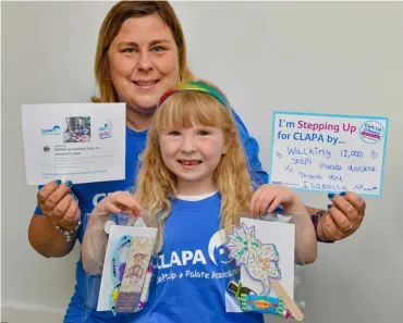 ?? Picture: Steve Smyth ?? BEST FOOT FORWARD: Isabella Waistell, with help from Mum Debbie, walked 12,000 steps every day for a week to raise funds for the Cleft Lip and Palate Associatio­n