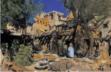  ?? Matt Jaffe / Special to The Chronicle ?? Top: Tribal ranger Robert Hepburn leads a group of visitors through Tahquitz Canyon in 2005. Above: Cabot’s Pueblo Museum is on the National Register of Historic Places.