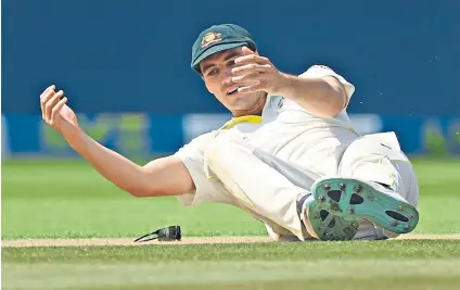  ?? ?? Down and out: Australia captain Pat Cummins reacts to dropping a catch