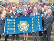  ??  ?? The Mod flag being handed over to Inverness on the steps of the Royal Concert Hall in Glasgow in 2019.