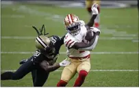  ?? BUTCH DILL — THE ASSOCIATED PRESS, FILE ?? San Francisco 49ers wide receiver Brandon Aiyuk (11) tries to evade Saints cornerback Janoris Jenkins (20) in the first half last Sunday in New Orleans.