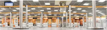  ?? — AFP ?? Deserted check-in desks are seen at Schoenefel­d airport during a strike of ground staff on Monday.