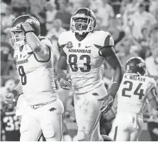  ?? KEVIN JAIRAJ, USA TODAY SPORTS ?? Quarterbac­k Austin Allen ( 8) threw three touchdown passes in Arkansas’ 41- 38 double- overtime win against TCU.