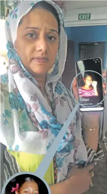  ?? Photo: Renu Radhika ?? Mubashra Begum showing a photo of her late daughter Sainaz Begum (circled).