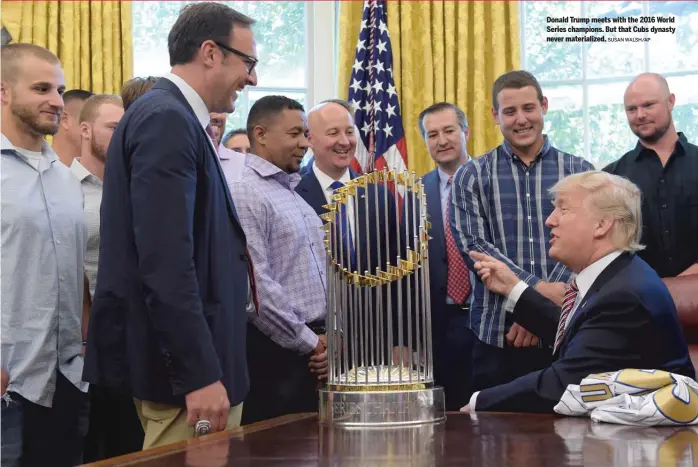  ?? SUSAN WALSH/AP ?? Donald Trump meets with the 2016 World Series champions. But that Cubs dynasty never materializ­ed.