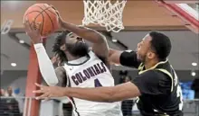  ?? Matt Freed/Post-Gazette ?? Robert Morris’ Jalen Hawkins, left, drives against Bryant’s Hall Elisias Thursday at UPMC Events Center.