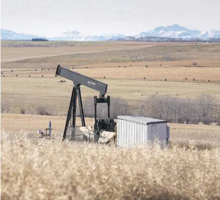  ?? JEFF MCINTOSH/THE CANADIAN PRESS FILES ?? A decommissi­oned pumpjack near Cremona, Alta. Out of up to 100,000 of Alberta’s inactive wells, 10 to 12 per cent are believed to be leaking at least some natural gas. Interwell Norway AS is using its technology to try to plug the “problem wells.”