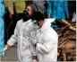  ?? CHANNI ANAND/AP ?? A grieving relative of a COVID-19 victim is consoled Wednesday at a crematoriu­m in Jammu, India.