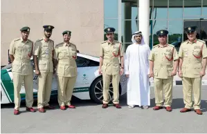  ?? Supplied photo ?? The Dubai Police took part in the UAE’s celebratio­ns of the Saudi National Day by using the logo launched by Dubai to mark the day on its patrols. The police’s social media channels also sported the logo. Here, Maj-Gen Abdullah Khalifa Al Marri,...