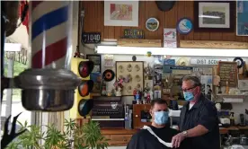 ?? Photograph: Callaghan O’Hare/Reuters ?? A man gets a haircut at Doug’s Barber Shop in Houston. Harris county, which includes Houston, has 157 virus cases per 100,000 people.