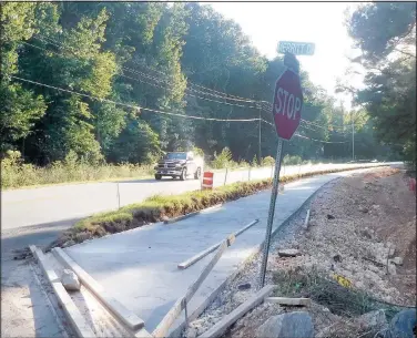  ?? (NWA Democrat-Gazette/Keith Bryant) ?? Concrete is in place across various patches of a 3-mile greenway spur connecting Blowing Springs to Metfield, including this section near the intersecti­on of Euston Road and Merrit Drive.
