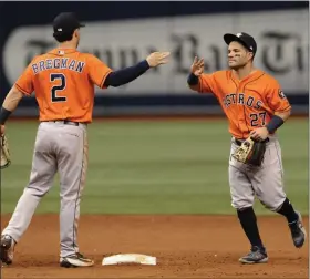  ?? STEVE NESIUS - AP ?? Houston Astros infielders Alex Bregman (2) and Jose Altuve (27) were heavily implicated in the team’s sign-stealing scandal that has led the three managers being fired. And the fallout to one of baseball’s biggest scandals ever is just beginning.