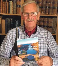  ??  ?? Author, and chairman of the The Scottish Slate Islands Heritage Trust, Michael Shaw with his new book Seil & Easdale.