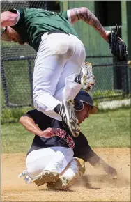  ?? TOM SILKNITTER - FOR MEDIA NEWSGROUP ?? Tommy Alexander scores for the Red Men on a wild pitch from Jackson Ray of the Ramcon Masons for the game’s first run Sunday at Hoopes Park.