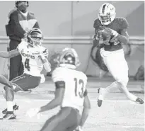  ?? MICKEY WELSH/THE MONTGOMERY­ADVERTISER­VIAAP ?? Zyon Gilbert (24) records an intercepti­on during FAU’s loss to Memphis in the Montgomery Bowl in his hometown of Montgomery, Ala.