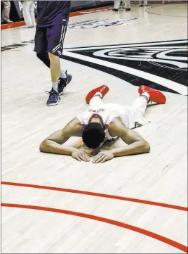  ?? Juan Antonio Labreche ?? The Associated Press New Mexico’s Elijah Brown is floored after a stunning 105-104 OT loss to UNR on Jan. 7.