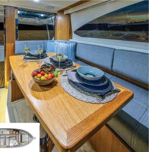  ??  ?? RIGHT A luxurious, well-padded settee wraps around the solid timber saloon table. FAR RIGHT From helm station to bathroom, the 395 carries the same immaculate presentati­on.