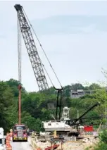  ??  ?? Work continues on the replacemen­t of the bridge over Germantown Road.