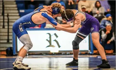  ?? Courtney Couey, Ringgold Tiger Shots ?? Tristan Busch (left) won the 144-pound title at the 43rd Rockmart Invitation­al this past Thursday. Busch went 4-0 on the day and was the only Ringgold wrestler to capture an individual title at the tournament.