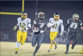  ?? Steven Eckhoff/RN-T ?? Pepperell’s Tae Hammond runs past the Spencer defense during Friday’s game in Lindale. The Dragons won 46-14 to move on in the playoffs.