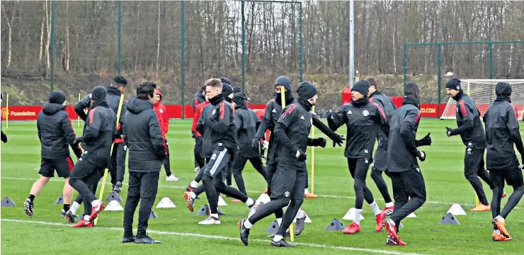  ??  ?? Out in force: Manchester United’s squad during practice at their Aon Training Complex, ahead of their last-16 tie in the Champions League tonight