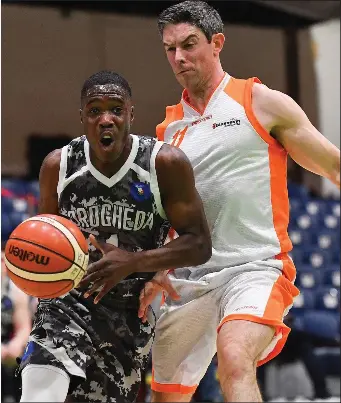  ?? Photos: Brendan Moran/Sportsfile ?? Tevin Thomas of Drogheda Bullets tries to shake off Glasnevin’s Peder Madsen during Friday night’s Hula Hoops NICC Men’s Cup Final at the National Basketball Arena in Tallaght.