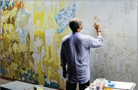  ??  ?? P.K. Sadanandan working on a mural.