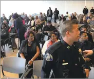  ?? COURTESY SAN JOSE POLICE DEPARTMENT ?? Congregant­s of the Emmanuel Baptist Church in San Jose held their Sunday service at the SJPD substation.