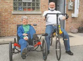  ??  ?? Sales consultant Julie Keating and shop owner Joe Reichert demonstrat­e some recumbent bike options at Amlings Cycle Shop in Niles.