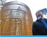  ??  ?? Chinese activist artist Ai Weiwei poses by one of his “Good Fences Make Good Neighbors” installati­ons, “Gilded Cage,” in New York’s Central Park. — AP photos