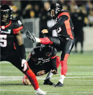  ?? SEAN KILPATRICK/THE CANADIAN PRESS ?? Redblacks kicker Lewis Ward nails a 52-yard field goal against the Hamilton Tiger-Cats last Friday night at TD Place, giving him a record 45 consecutiv­e successful attempts.