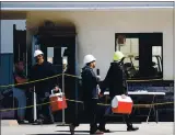  ??  ?? Central Valley Meat Co. employees leave the plant on Wednesday. Company officials have placed workers farther apart and have them take staggered breaks.