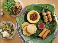  ?? MIA YAKEL ?? Snackboxe Bistro offers a contempora­ry take on food from Laos.