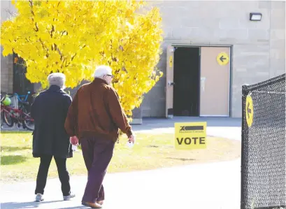  ?? JEAN LEVAC/POSTMEDIA NEWS ?? Voters head to a polling station in Kanata Carleton riding on Monday.