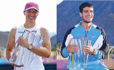  ?? AP ?? Iga Swiatek of Poland (left) holds the trophy after defeating Maria Sakkari of Greece in the final match as Carlos Alcaraz of Spain poses with his trophy after defeating Daniil Medvedev of Russia in the men’s final at the BNP Paribas Open tennis tournament in Indian Wells, California.