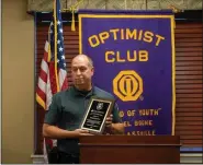  ??  ?? Birdsboro Police Officer Alan Fay accepts the Officer of the Year Award from the Daniel Boone Optimist Club at Keystone Villa at Douglassvi­lle.