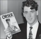  ?? RICHARD LAUTENS, TORONTO STAR ?? Brian Orser holds Orser, A Skater’s Life, he wrote with Steve Milton.