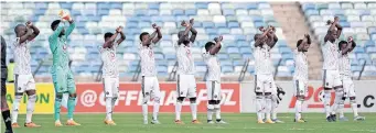  ?? BackpagePi­x ?? ORLANDO Pirates players salute their fans, The Ghost, after beating AmaZulu.